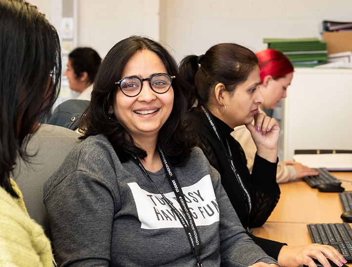 Student in classroom talking to one another