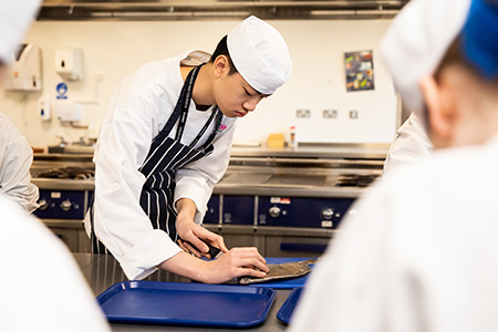 Students using the specialised facilities to cook